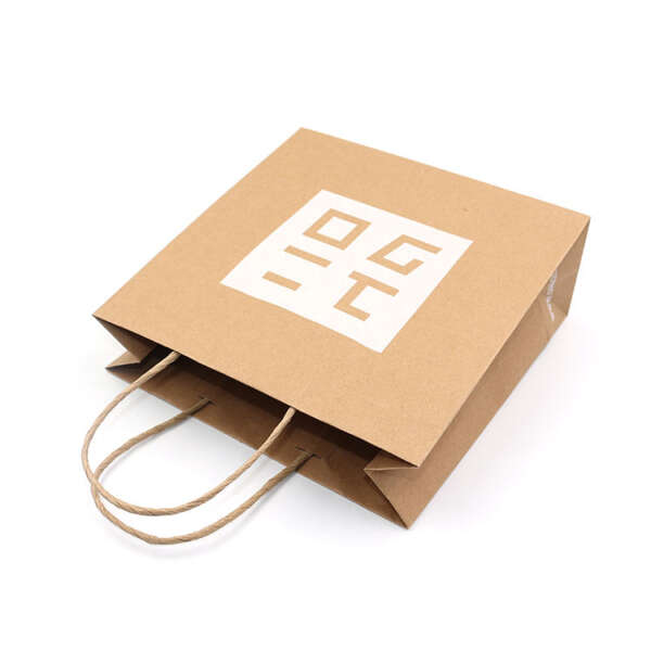 kraft paper or art paper large printed paper packaging bag with handle with logo printing detail