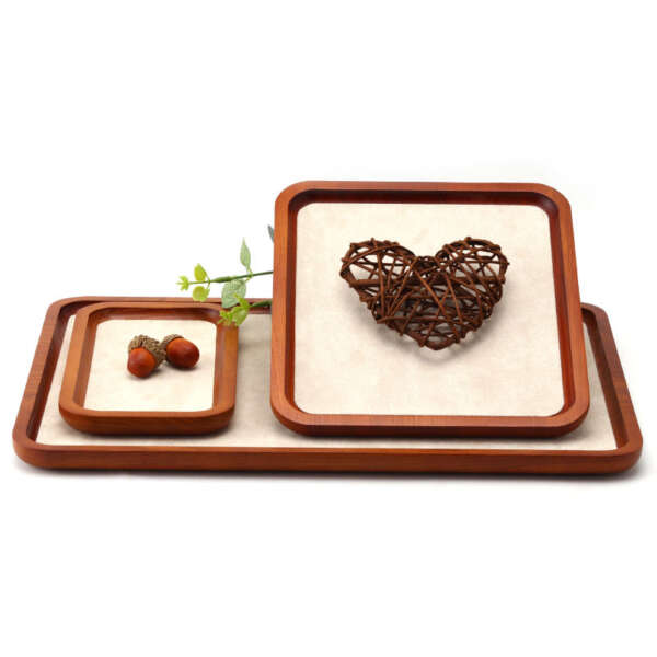 Open wooden jewelry display tray showing organized compartments