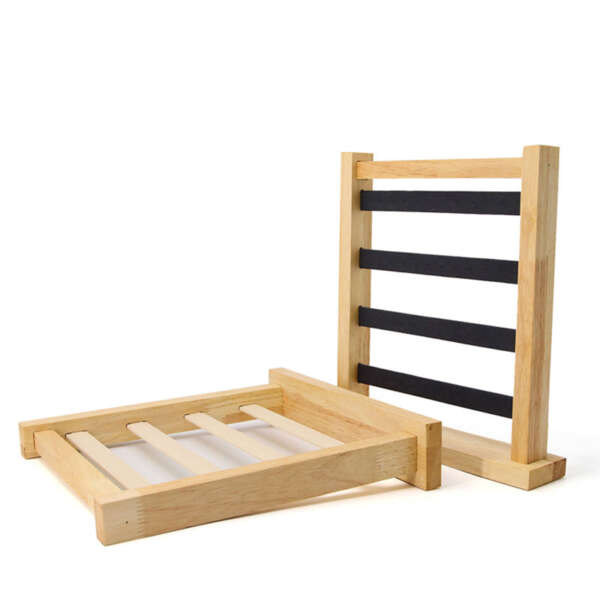Open 4 layer earring rack showing display slots