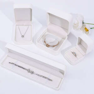 white leather travel jewelry storage box for necklace earrings studs ring - front view