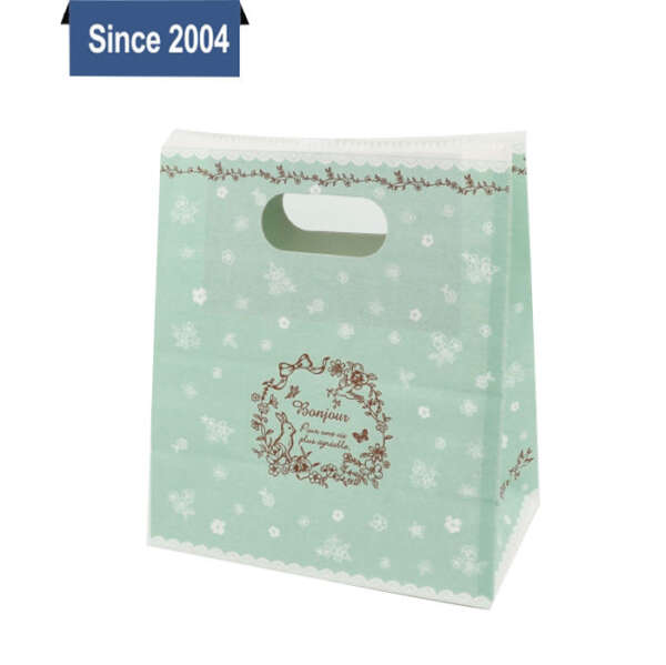 colorful Christmas paper shopping bag with custom handles - print detail view