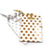 white polka dot Christmas gift paper bag with kraft handles front view