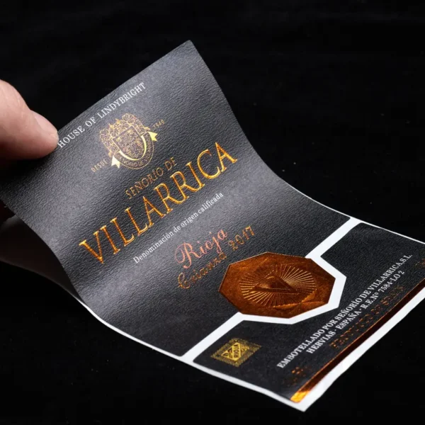 matt black textured paper gold foil embossed red wine label front view