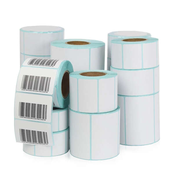 Adhesive paper label rolls