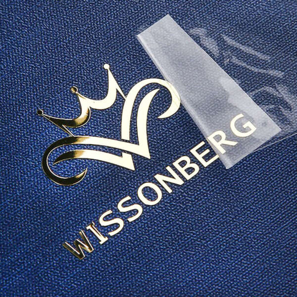 Transparent transfer label with metallic logo effect