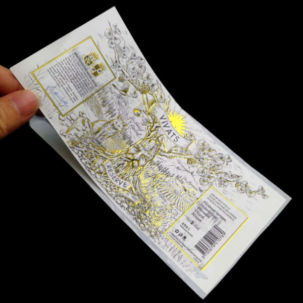 matt black textured paper gold foil embossed red wine label bottle application view