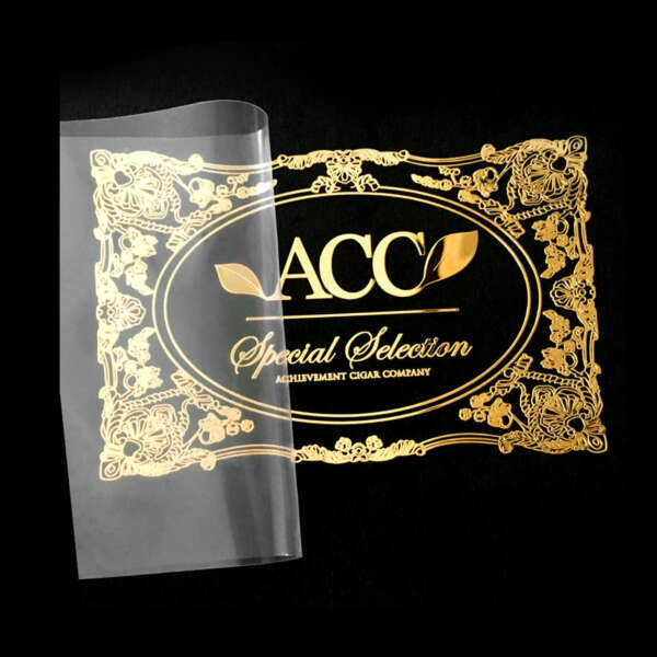 Adhesive metallic decals with raised logo effect