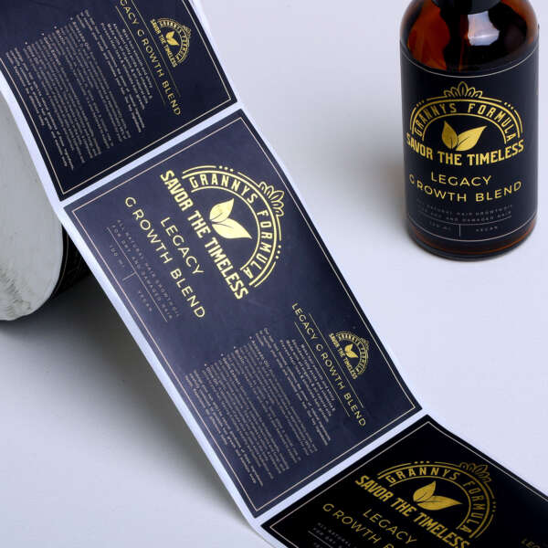 Embossed gold foil bottle labels for cosmetic packaging production
