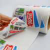 Weatherproof adhesive product label rolls
