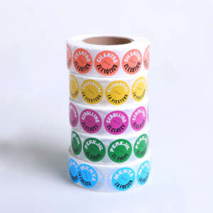 Waterproof synthetic paper circle sticker roll with black logo design