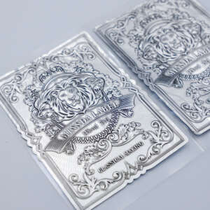 silver aluminum foil metal embossed brand logo wine bottle label front view