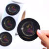 Printed self adhesive logo labels on round sticker roll