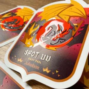 Spot UV raised die cut logo stickers