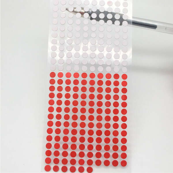 White sensitive paper label that turns red with water