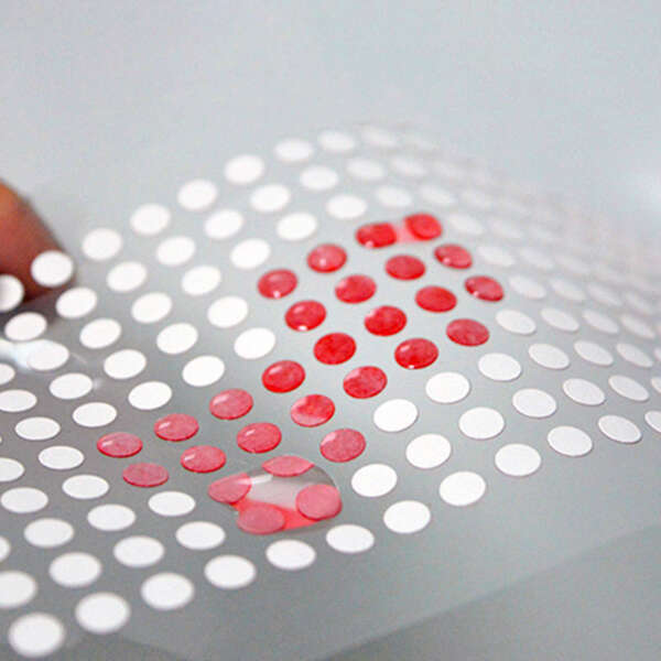 Irreversible color change moisture indicator label