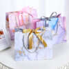 pink luxury rose gold stamped paper gift bag with silk ribbon handle view 6